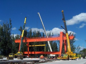 Harrison Crane Service utilizing 240 ton, 175 ton, and 165 ton hydros to erect large straddle crane